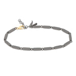 BRACCIALE NAVETTE IN TITANIO CON MOSCHETTONE IN ORO GIALLO 9 KT