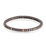 BRACCIALE TENNIS LINEA ELASTICA IN TITANIO, ORO ROSSO 18 KT E 10 DIAMANTI WHITE DA 5 PUNTI.