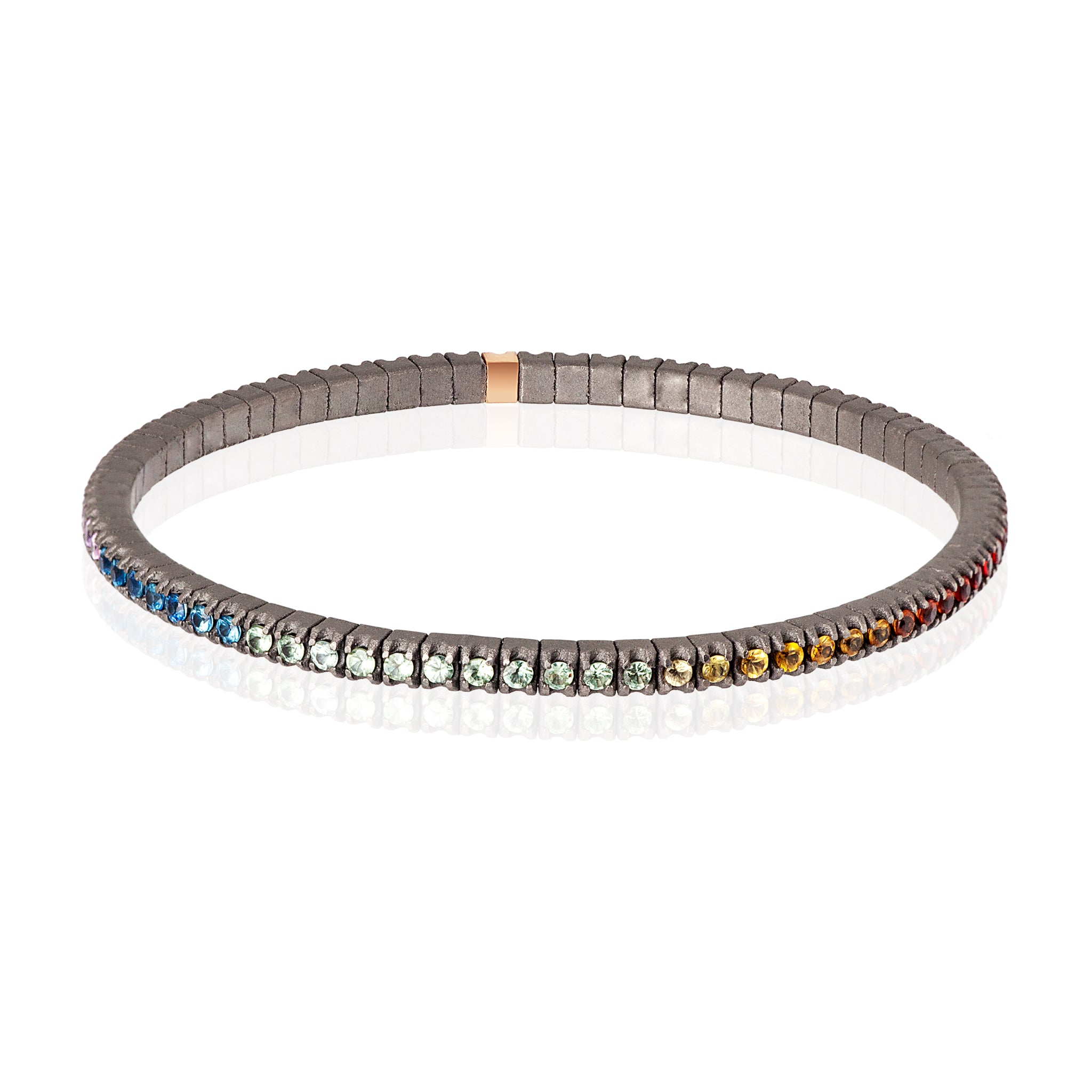 BRACCIALE TENNIS LINEA ELASTICA IN TITANIO, ORO ROSSO 18 KT E ZAFFIRI MULTICOLOR DA 3 PUNTI.