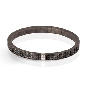 BRACCIALE LINEA LOOP IN TITANIO, DIAMANTI BLACK, ORO BIANCO 18 KT E DIAMANTI WHITE.