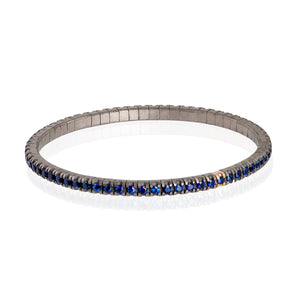 BRACCIALE TENNIS LINEA LOOP IN TITANIO, ORO ROSSO 18 KT E ZAFFIRI BLU DA 5 PUNTI.